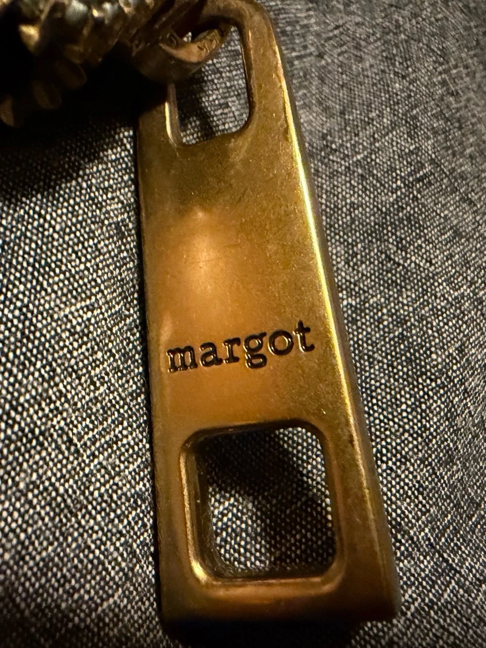 Margot “Gabby” zip around wallet in grey/beige with light blue accents.